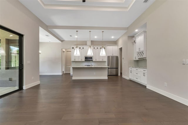 unfurnished living room featuring recessed lighting, dark wood finished floors, visible vents, and baseboards