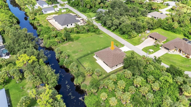 bird's eye view with a water view and a residential view