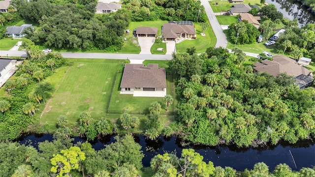 birds eye view of property featuring a water view and a residential view