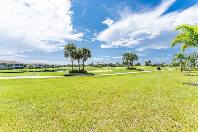 surrounding community featuring a water view and a yard