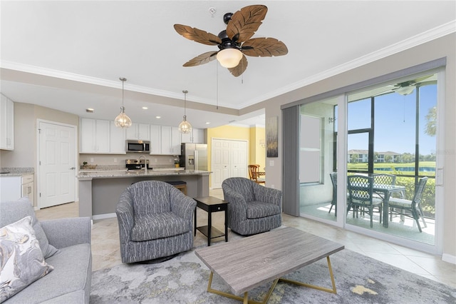 living room with crown molding, light tile patterned floors, and ceiling fan