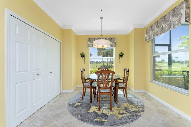 dining space with crown molding