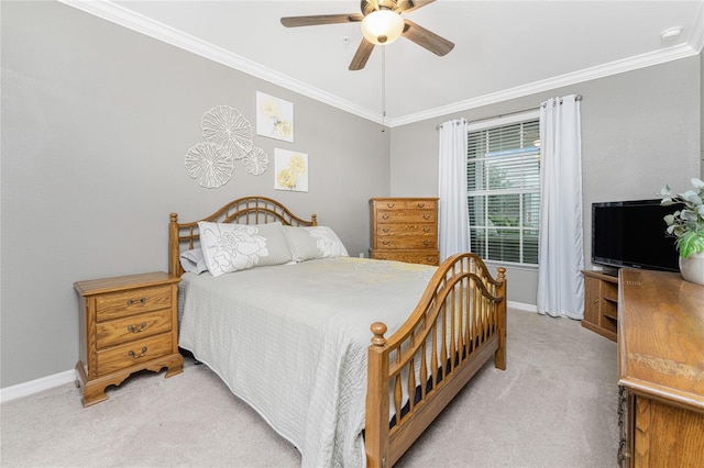 carpeted bedroom with crown molding and ceiling fan