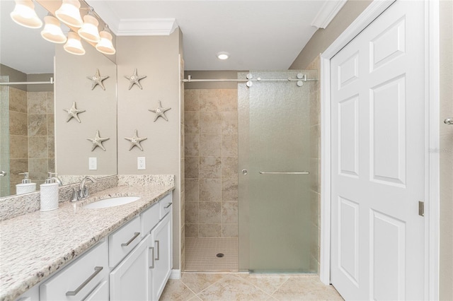 bathroom with crown molding, tile patterned flooring, vanity, and a shower with shower door