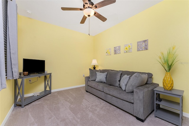 living room featuring ceiling fan and light colored carpet