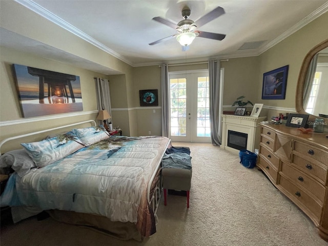 bedroom featuring light colored carpet, access to outside, crown molding, ceiling fan, and french doors