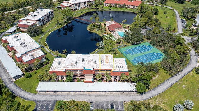 birds eye view of property with a water view