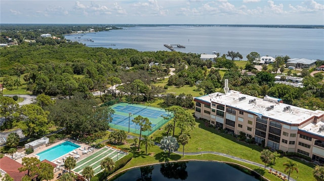 birds eye view of property with a water view