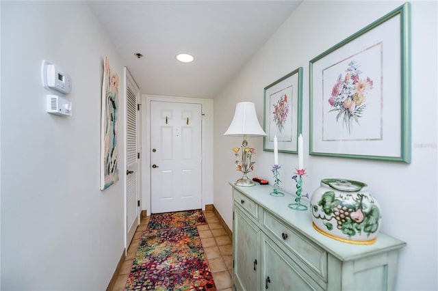 entryway with light tile patterned floors