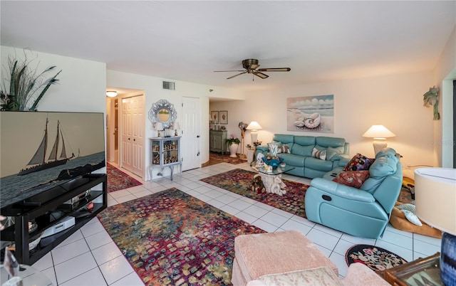 living room featuring ceiling fan and light tile patterned floors