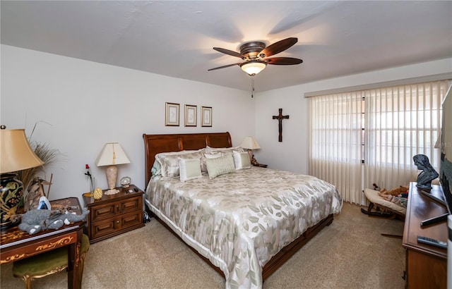 bedroom featuring ceiling fan and light carpet