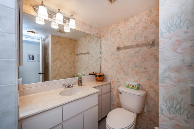 bathroom with vanity and toilet