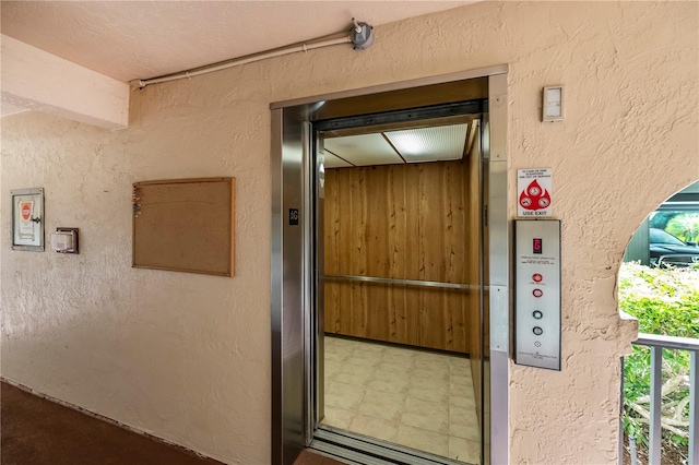 entrance to property featuring elevator