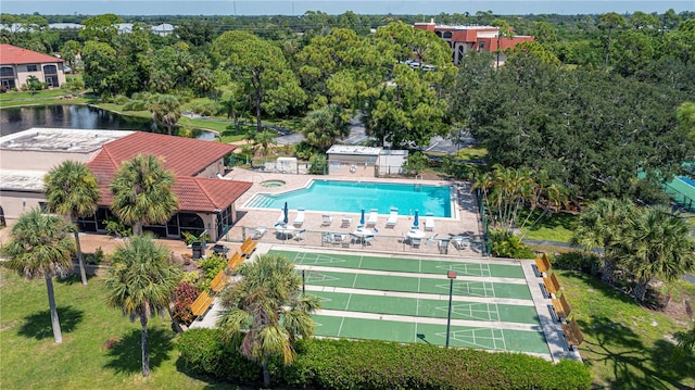 view of pool featuring a water view and a patio area