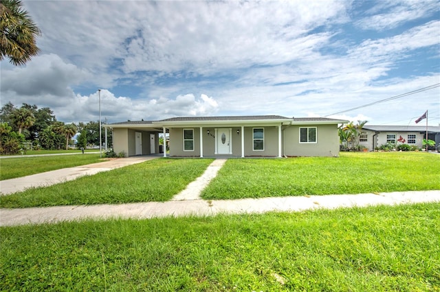 ranch-style house with a front yard and a carport