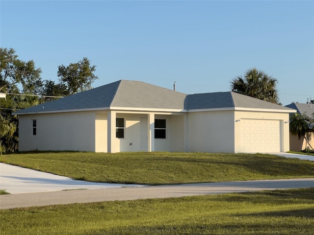 ranch-style house featuring a garage and a front yard