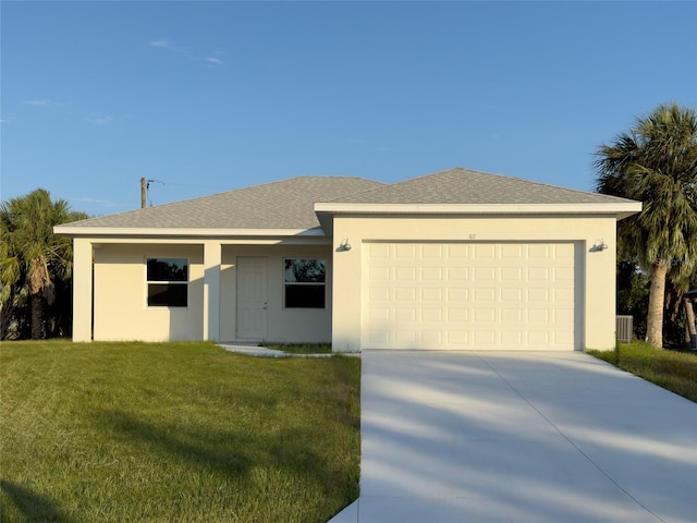 single story home featuring a garage, a front lawn, and central air condition unit