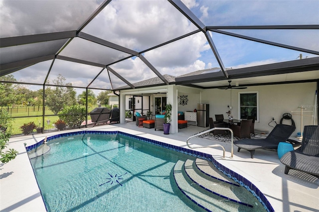 view of swimming pool with a lanai, outdoor lounge area, a patio, and ceiling fan