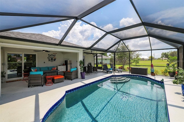 view of swimming pool with a patio, outdoor lounge area, a lanai, and ceiling fan