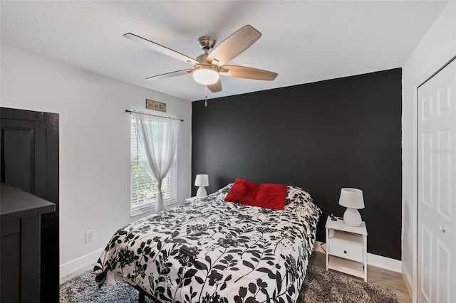 bedroom featuring a closet, ceiling fan, and hardwood / wood-style floors