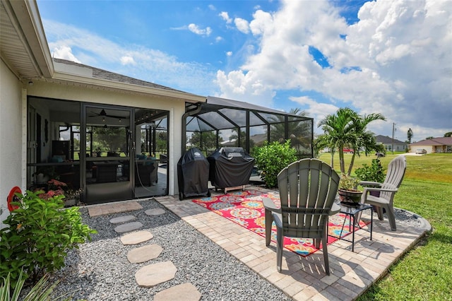 view of patio featuring a lanai and a grill