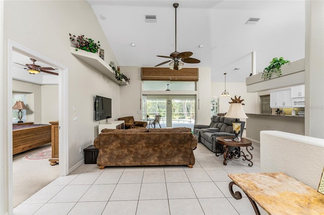 living room with light tile patterned floors, high vaulted ceiling, and ceiling fan