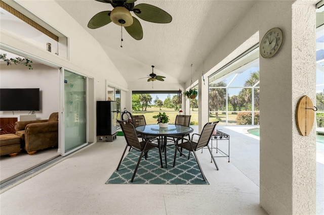 view of patio with ceiling fan and a lanai