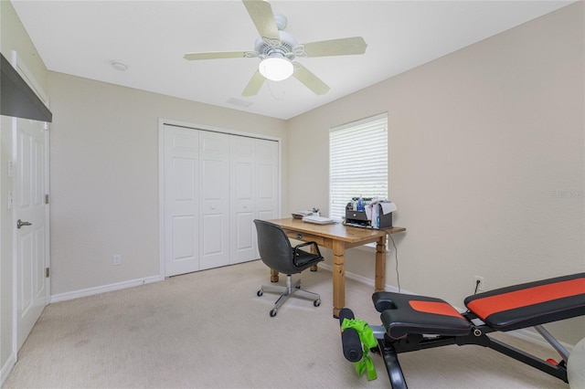 carpeted office with ceiling fan