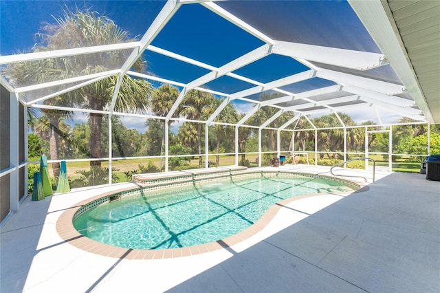 view of pool with a patio and a lanai