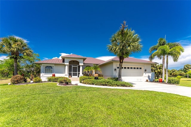 view of front of house featuring a garage and a front yard