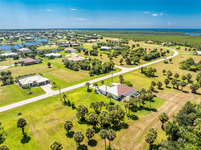 drone / aerial view featuring a rural view and a water view