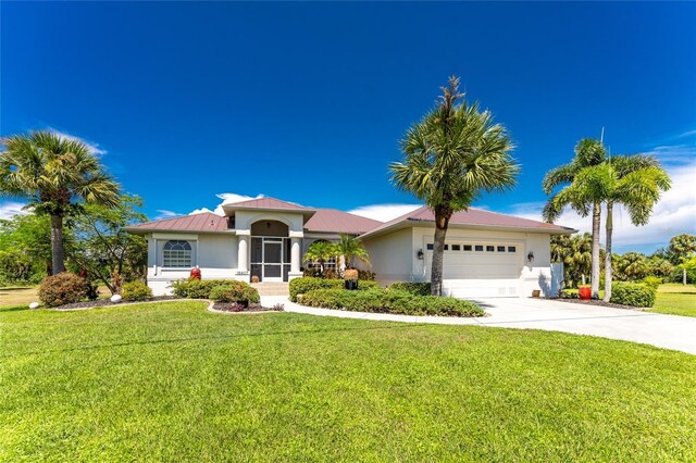 16407 San Edmundo Rd, Punta Gorda, FL 33955 - view of front of property with driveway, stucco siding, a garage, and a front yard