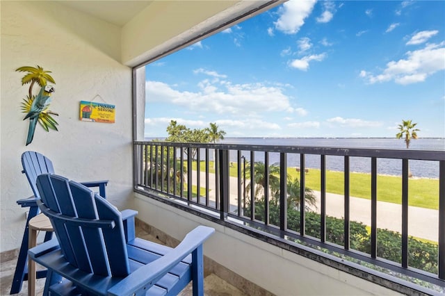 balcony featuring a water view