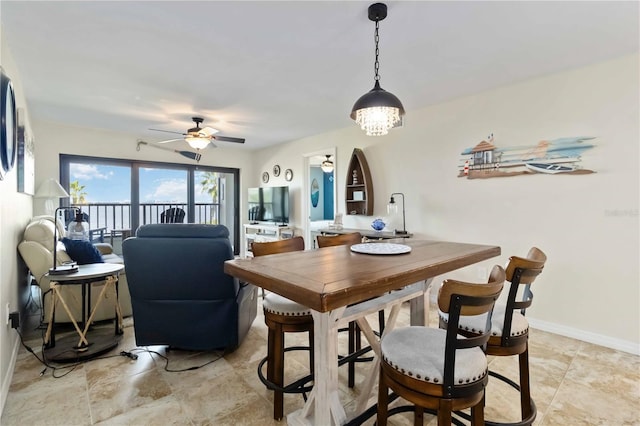 dining space featuring ceiling fan