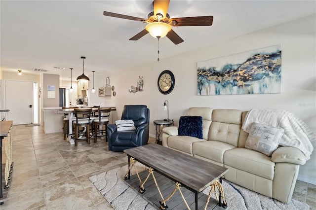 living room with ceiling fan