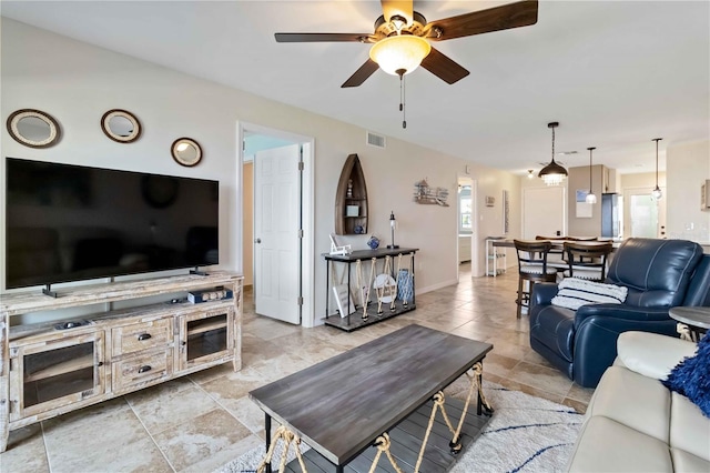 living room featuring ceiling fan