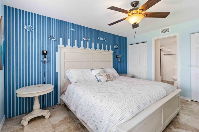 bedroom with ceiling fan and ensuite bathroom