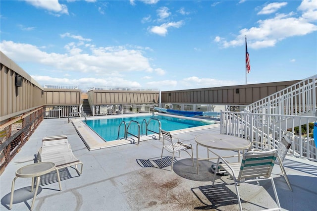 view of pool featuring a patio area