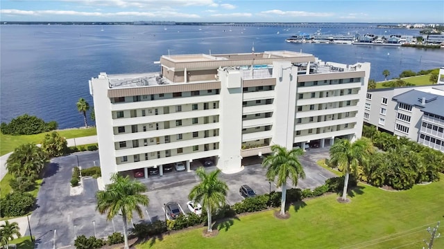 birds eye view of property with a water view