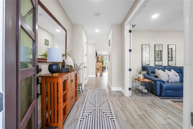 hall featuring light wood-type flooring