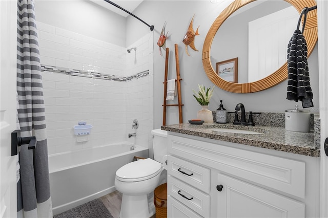 full bathroom with shower / bath combination with curtain, hardwood / wood-style flooring, vanity, and toilet