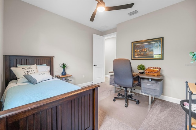 bedroom featuring ceiling fan and carpet