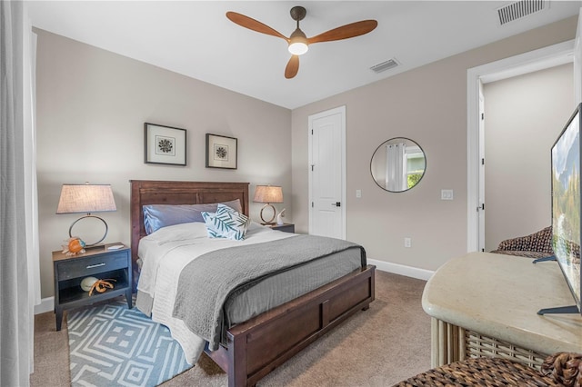 bedroom with ceiling fan, carpet flooring, and multiple windows