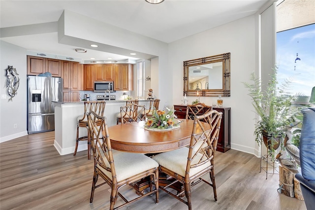 dining room with light hardwood / wood-style floors