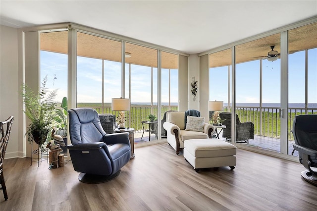 sunroom / solarium with ceiling fan and a wealth of natural light