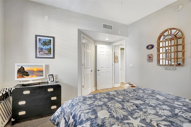 bedroom with hardwood / wood-style floors