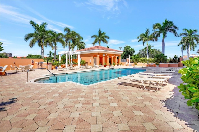 view of pool with a patio and a pergola