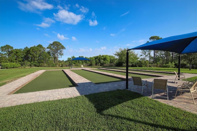 view of property's community with a yard