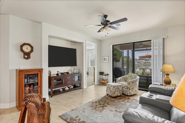 living room with light tile patterned floors and ceiling fan