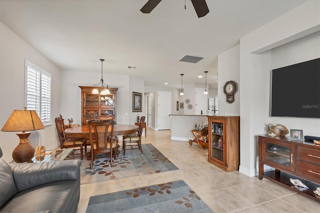 dining area with ceiling fan and light tile patterned flooring